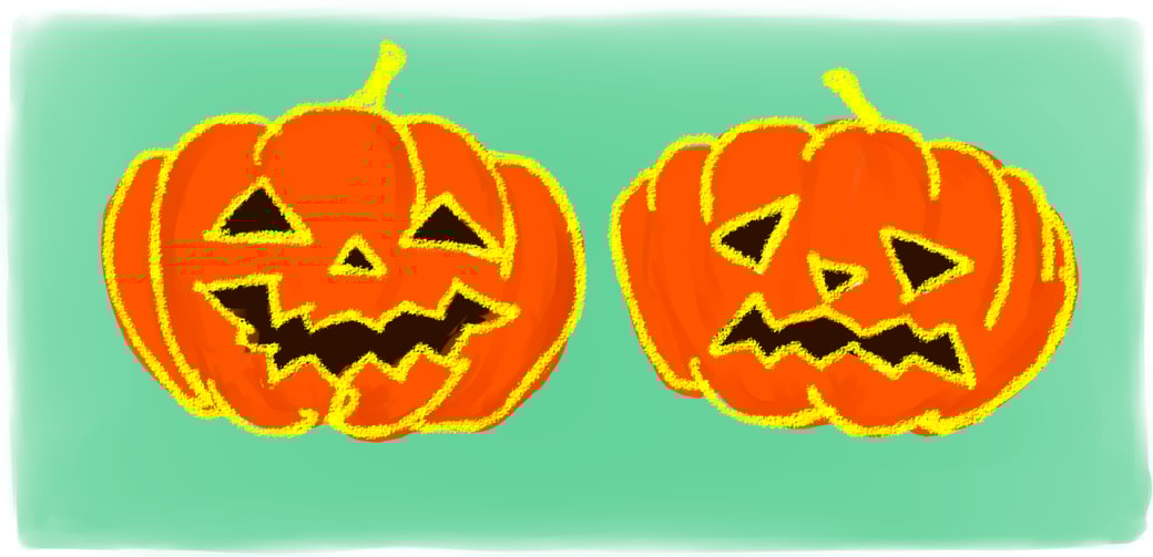 二つ並んだジャック・オ・ランタン。一つは笑っていて、一つはベソをかいている。
